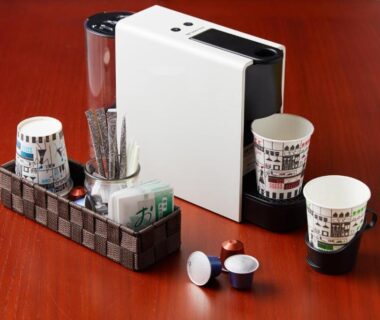 Coffee maker, cups and condiments on wooden table at Kyomachiya Hotel Mifuku, Kyoto
