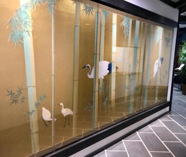 Decorative gold screen with cranes and bamboo at Kyomachiya Ryokan Sakura Urushitei, Kyoto