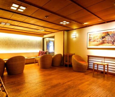 Wicker seating and soft lighting in a tatami lounge at Togetsutei in Arashiyama Kyoto