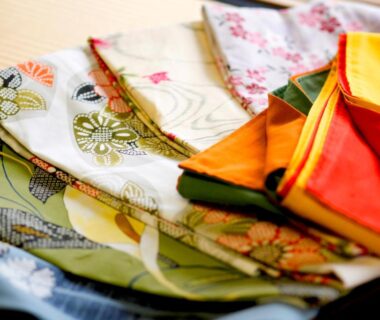 Folded patterned yukata and obis prepared for guests at Kyoto Arashiyama Onsen Ryokan Togetsutei