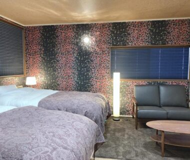 Twin beds with sofa and low table at Kyoto Ryokan Gion Sano, Kyoto
