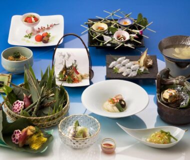 Selection of small traditional Japanese dishes arranged for a multi-course meal at Kyoto Ryokan Hirashin in Kyoto