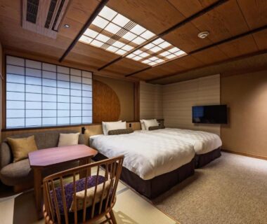 Twin beds on tatami with shoji and low table at Kyoto Ryokan SAKANOUE, Kyoto