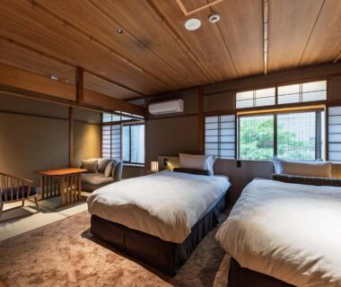 Twin beds, shoji screens, wooden ceiling, seating area, garden view at Kyoto Ryokan SAKANOUE, Kyoto Kansai
