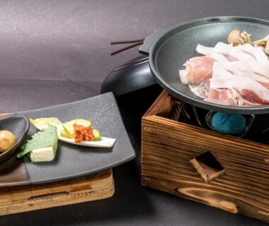Tabletop nabe hot pot with sliced meat and mushrooms at Kyoto no Yado Gion no Tsuki, Kyoto