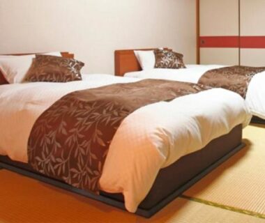 Low beds on tatami flooring in a guest room at Kyukamura Ohkunoshima, Chūgoku Hiroshima, Japan