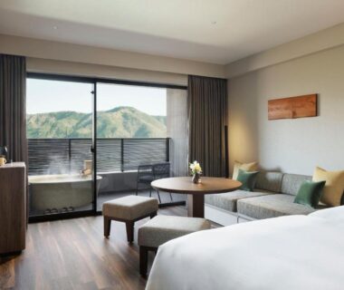 Spacious guest room with balcony and seating area at Laforet Hakone Gora Kanagawa