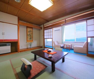 Traditional tatami room with low table, shoji screens and lake view at Lake Side Hotel Minatoya, Fukushima