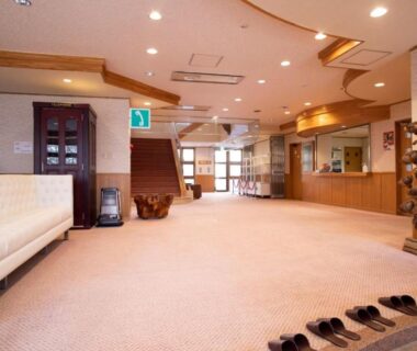 Carpeted lobby with rows of slippers at Lake Side Nikko Hotel, Tochigi, Kanto, Japan