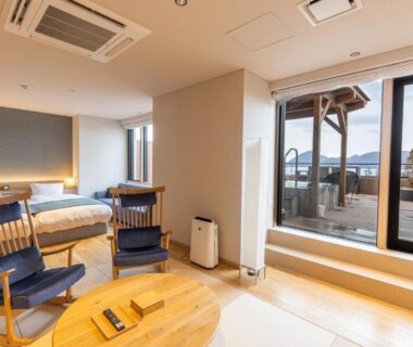 Two-bed modern guest room with terrace and seating at Lake Toya Tsuruga Resort HIKARINOUTA Hokkaidō Japan