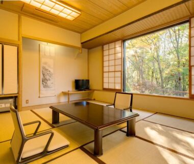 Traditional tatami room with low table and shoji screens at Lake Yamanakako Shuzansou in Chūbu, Yamanashi