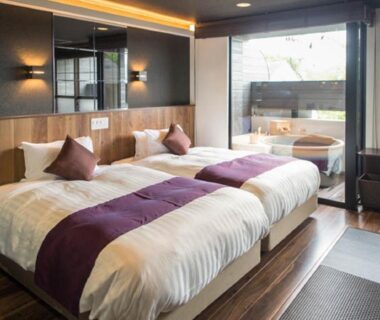 Twin beds with tatami area and balcony wooden tub at LiVEMAX RESORT Aki Miyahama Onsen Hiroshima