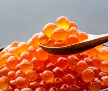 Close-up of ikura salmon roe in a bowl with wooden spoon at LiVEMAX RESORT Hakone Ashinoko, Kanagawa