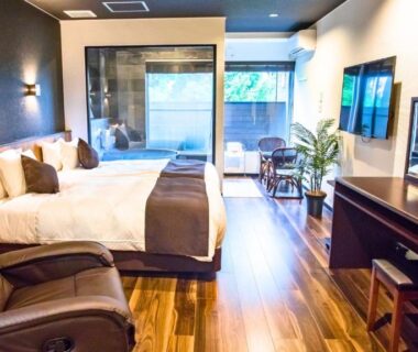 Two western beds, massage chair, hardwood floor and balcony at LiVEMAX RESORT Hakone Ashinoko, Kanagawa, Japan