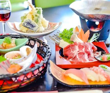 Assorted sashimi, tempura and hot pot on lacquer trays at LiVEMAX RESORT Hakone Sengokuhara, Kanagawa
