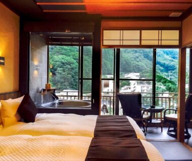 Tatami-style room with beds and balcony at LiVEMAX RESORT Kawaji in Kantō, Tochigi