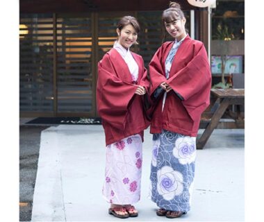 Two guests wearing yukata and haori standing outside LiVEMAX RESORT Kinugawa in Tochigi, Kantō, Japan