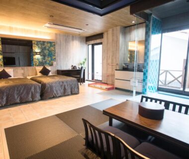 Spacious room with twin beds, tatami seating area and balcony at LiVEMAX RESORT Kyotango