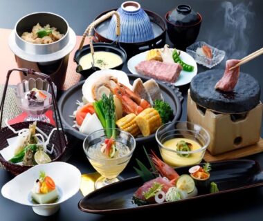Assorted Japanese small dishes with tabletop grill at Livemax Resort Yuhigaura Kitu Onsen Kyoto
