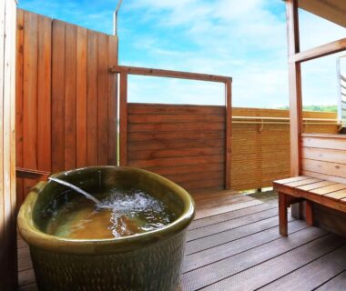 Ceramic soaking tub on wooden veranda at Manten no Tsujinoya, Ishikawa, Chūbu, Japan
