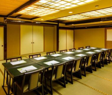 Tatami dining room with low tables and chairs at Maruei ryokan in Yamanashi Chūbu Japan