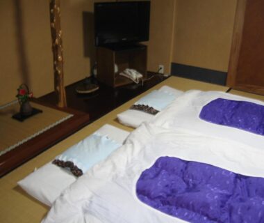 Tatami floor with futon bedding at Maruka Ryokan in Nagano, Chūbu