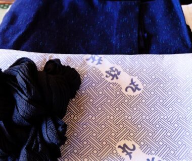 Traditional folded yukata and obi at Maruyaso ryokan in Yamanashi, Chubu