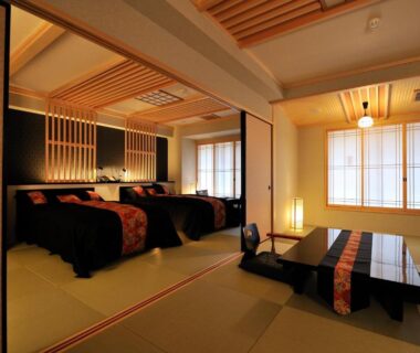Tatami room with twin beds, low table and shoji screens at Matsui Honkan, Kyoto