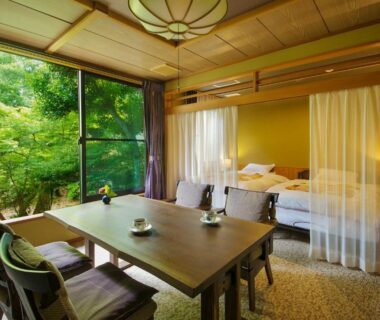 Tatami seating, low table and beds with garden view at Matsusaki, Ishikawa, Chūbu, Japan