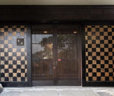 Checkerboard wooden entrance with lattice sliding doors at Matsushima Koumura in Miyagi, Tōhoku
