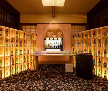 Bottle-lined shelves and bar counter at Meitei no Yado Hotel Koshien, Yamanashi, Chūbu