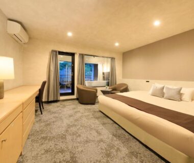 Carpeted room with two beds, seating area and balcony doors at Merveille Hakone Gora, Kanagawa, Kantō, Japan