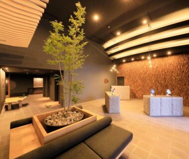 Reception area with seating, indoor planter and warm lighting at Merveille Hakone Gora, Kanagawa, Japan
