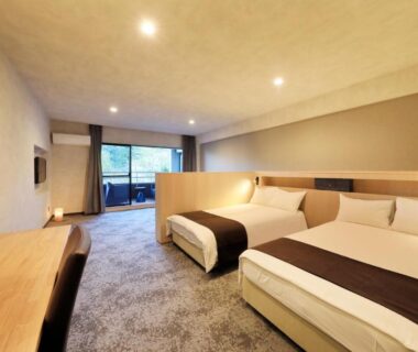 Bright twin guest room with balcony and desk at Merveille Hakone Gora in Kanagawa Japan