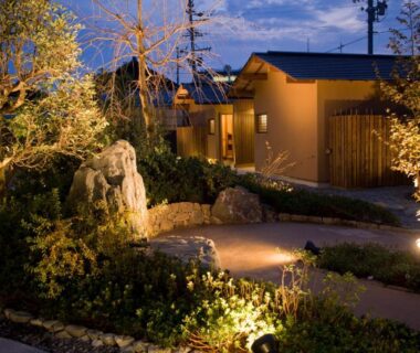 Lit garden pathway leading to Migiwaya entrance in Shizuoka, Chūbu, Japan
