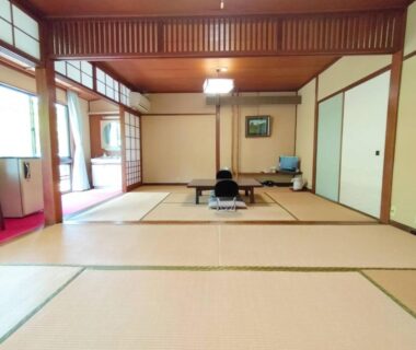 Spacious tatami room with low table, shoji screens and sliding fusuma at Migumiya Ryokan, Hyōgo, Kansai