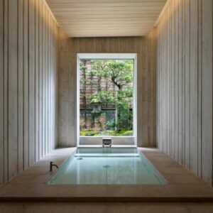 Recessed wooden soaking tub with garden view at Mikuniya, Hyōgo