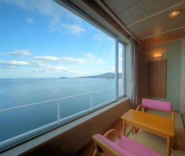 Tatami room with low table and wide window overlooking the sea in Minami Sanriku, Miyagi