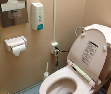 Japanese bidet toilet in compact restroom at Minshuku Iwatakan, Gifu, Chūbu, Japan