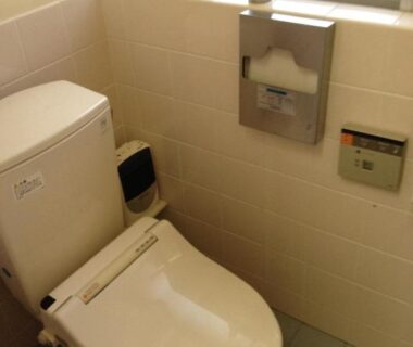 Compact tiled bathroom with electronic bidet at Minshuku Iwatakan in Chūbu, Gifu, Japan