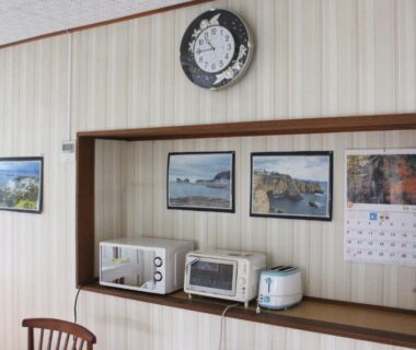 Small kitchenette with microwave, toaster oven and rice cooker in Minshuku Katsuya shared area, Wakayama, Kansai