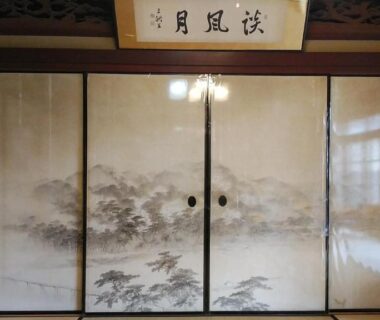 Painted fusuma sliding doors and shoji screen in a traditional ryokan room at Minshuku Kitamaebune, Ishikawa