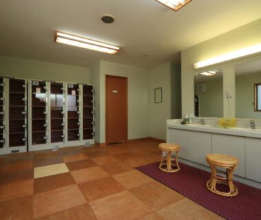 Mirrors, sinks, stools and lockers in a ryokan changing room at Minshuku Miyama, Nagano