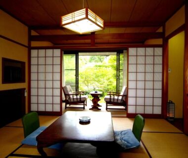 Traditional tatami room with low table, shoji screens and garden view at Mitake, Kanagawa