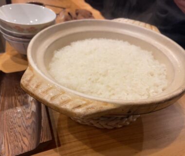Donabe pot of cooked rice on wooden table at Mitsubikiya, Nagano, Chubu