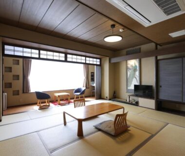 Tatami room with low table and floor chairs at Miyahama Grand Hotel, Chūgoku Hiroshima