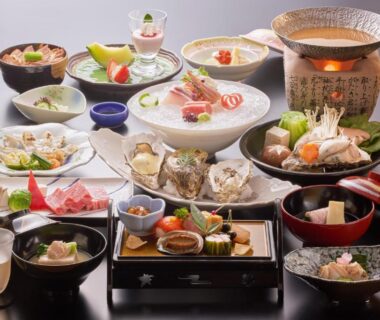 Assorted multi-course dishes with sashimi and hot pot at Miyajima Hotel Makoto, Hiroshima, Chūgoku