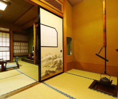 Traditional tatami room with suspended hearth and shoji screens at Miyamaso in Gifu, Chubu