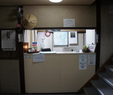 Reception desk with hanging lantern and notices, Miyoshiya Ryokan, Wakayama, Kansai Japan