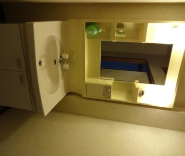 Bathroom sink and mirror at Mizubasho no Yado Higashi in Gunma